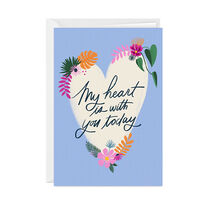 Custom vertical fold card with a heart with flowers on a blue background.