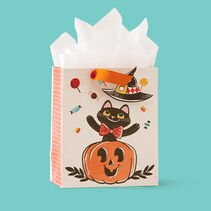 Witchy black cat popping out of a pumpkin gift bag.