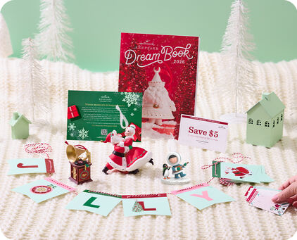 Contents of the 2026 Dream Box with white bottle brush trees and blanket