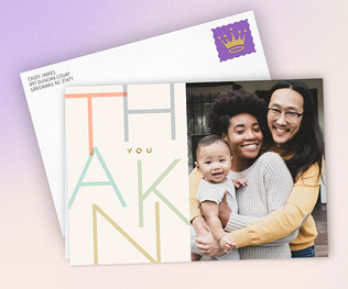 Photo of smiling family on thank you card