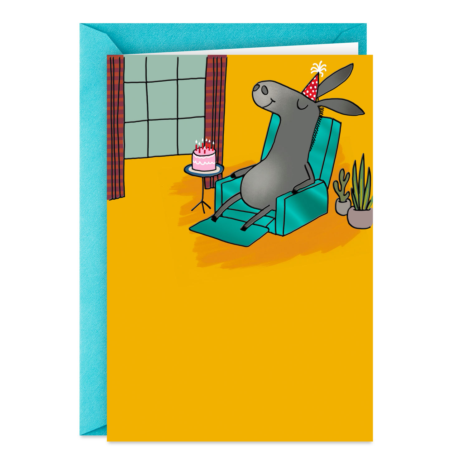 Donkey in an armchair with a birthday cake