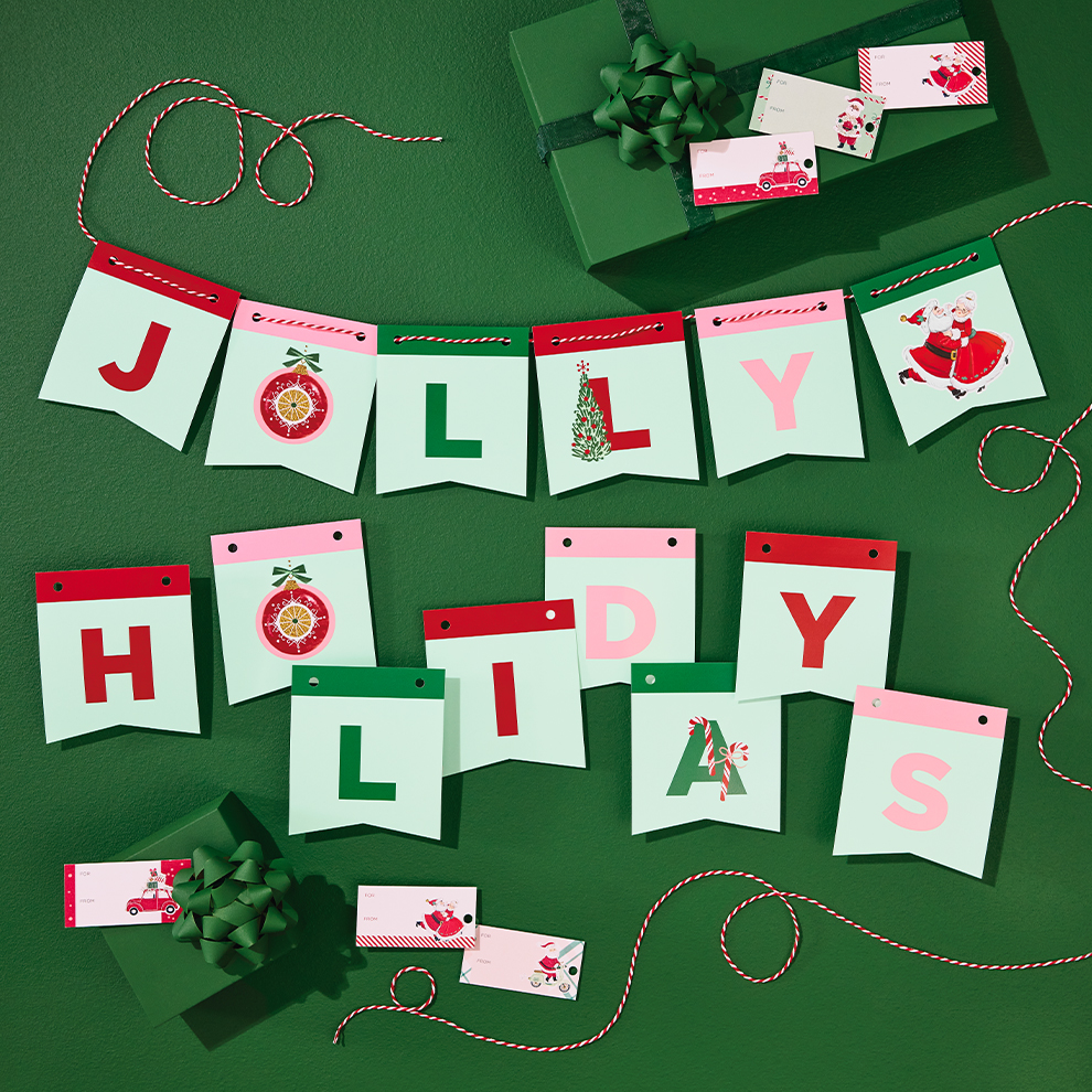 Festive banner spelling 'Jolly holiday' with pennants